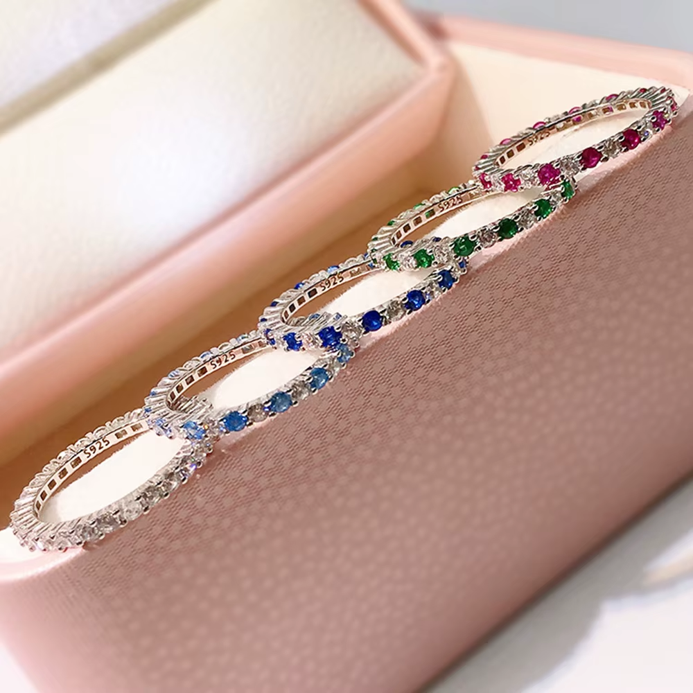 Color-stone 925 silver rings arranged in a jewelry tray